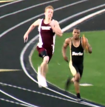 In another gutsy performance, Stephon Wasington (right) blows by competion on anchor leg of 1600 relay at last weeks Dennis Smith Invitational.