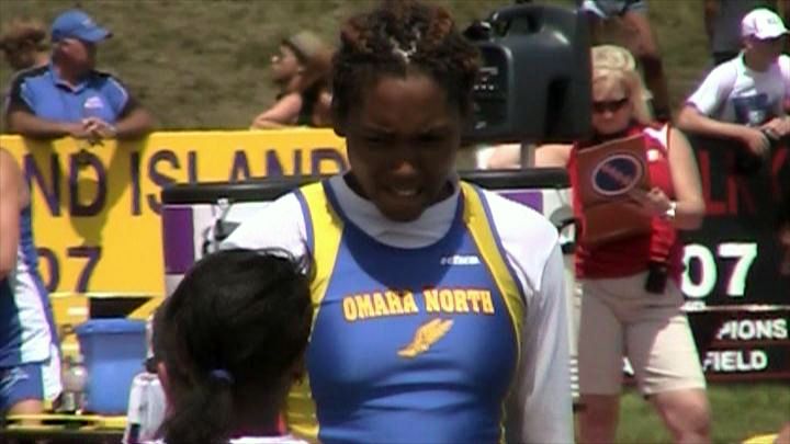 LaQue Moen-Davis talking with teammate at 2011 Nebraska state track meet.