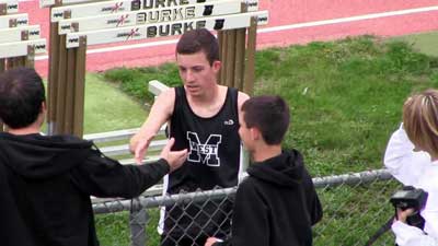 Millard West's Joe Harter receives high fives, shakes and hugs from friends and family,after record breaking run.
